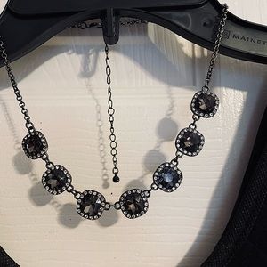 Necklace with faux stone and rhinestones.